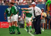 18 June 1994; Republic of Ireland manager Jack Charlton splashes water on Tommy Coyne, 15, and Andy Townsend during the FIFA World Cup 1994 Group E match between Republic of Ireland and Italy at Giants Stadium in New Jersey, USA. Photo by Ray McManus/Sportsfile