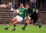 2 March 2002; Richard Haran of Charlestown Sarsfield is tackled by Derek Kavanagh of Nemo Rangers during the AIB GAA Football All-Ireland Senior Club Championship Semi-Final match between Nemo Rangers and Charlestown Sarsfield at McDonagh Park in Nenagh, Tipperary. Photo by Damien Eagers/Sportsfile