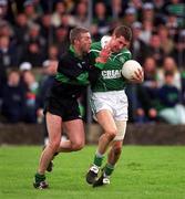 2 March 2002; Richard Haran of Charlestown Sarsfield is tackled by Larry Kavanagh of Nemo Rangers during the AIB GAA Football All-Ireland Senior Club Championship Semi-Final match between Nemo Rangers and Charlestown Sarsfield at McDonagh Park in Nenagh, Tipperary. Photo by Damien Eagers/Sportsfile
