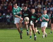 2 March 2002; Kevin Cahill of Nemo Rangers in action against Aidan Higgins of Charlestown Sarsfields during the AIB GAA Football All-Ireland Senior Club Championship Semi-Final match between Nemo Rangers and Charlestown Sarsfield at McDonagh Park in Nenagh, Tipperary. Photo by David Maher/Sportsfile