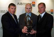 4 March 2002; Fergal Hartley of Ballygunner, Munster Hurling Award Winner, centre, with Uachtarán Chumann Lœthchleas Gael Sean McCague, left, and Managing Director of AIB Eugene Sheehy, during the AIB GAA Provincial Player of the Year Awards 2001 at AIB Bankcentre in Ballsbridge, Dublin. Photo by Ray McManus/Sportsfile