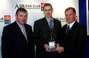 4 March 2002; Enda Muldoon of Ballinderry, Ulster Football Award Winner, centre, with Uachtarán Chumann Lœthchleas Gael Sean McCague, left, and Managing Director of AIB Eugene Sheehy, during the AIB GAA Provincial Player of the Year Awards 2001 at AIB Bankcentre in Ballsbridge, Dublin. Photo by Ray McManus/Sportsfile