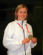 4 March 2002; Karen Shinkins of Ireland with her bronze medal from the Women's 400m at the European Indoor Championships in Vienna, Austria, upon her return at Dublin Airport in Dubln. Photo by Aoife Rice/Sportsfile