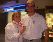 4 March 2002; Karen Shinkins of Ireland with her coach Paul Doyle and her bronze medal from the Women's 400m at the European Indoor Championships in Vienna, Austria, upon her return at Dublin Airport in Dubln. Photo by Aoife Rice/Sportsfile