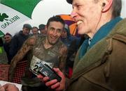 24 February 2002; Peter Mathews of Dundrum South Dublin AC is interviewed by journalists after winning the Senior Men's race at the Inter Club Cross Country Championships of Ireland at the ALSAA Complex in Dublin. Photo by Ray Lohan/Sportsfile