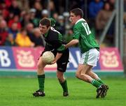 2 March 2002; Derek Kavanagh of Nemo Rangers in action against Mark Caffrey of Charlestown Sarsfields during the AIB GAA Football All-Ireland Senior Club Championship Semi-Final match between Nemo Rangers and Charlestown Sarsfield at McDonagh Park in Nenagh, Tipperary. Photo by Damien Eagers/Sportsfile