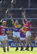 9 March 2002; Larry O'Gorman of Wexford and Alan Cummins of Cork reach for a dropping ball during the Allianz National Hurling League Division 1B Round 2 match between Cork and Wexford at Páirc U’ Chaoimh in Cork. Photo by Brendan Moran/Sportsfile