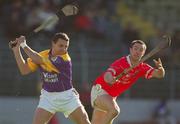 9 March 2002; Larry O'Gorman of Wexford in action against Alan Cummins of Cork during the Allianz National Hurling League Division 1B Round 2 match between Cork and Wexford at Páirc Uí Chaoimh in Cork. Photo by Brendan Moran/Sportsfile