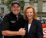12 June 2013; Clare Tiernan, from Castleknock, Co. Dublin, with Shane Lowry at the Newstalk’s official sponsorship of The Irish Open 2013, taking place from Thursday 27th to Sunday 30th June 2013 in Carton House, putting challenge today in Dublin City Centre. South King Street, Dublin. Photo by Matt Browne/Sportsfile