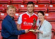 13 June 2013; Killian Brennan, St. Patrick's Athletic, who was presented with the Airtricity / SWAI Player of the Month Award for May 2013 by Jillian Saunders, Airtricity, along with St. Patrick's Athletic manager Liam Buckley, at Richmond Park in Dublin. Photo by Brian Lawless/Sportsfile