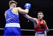 17 February 2017; Sean McComb of Holy Trinity, right, exchanges punches with Wayne Kelly of Ballynacargy during their 64KG bout at the 2017 IABA Elite Boxing Championship finals in the National Stadium, Dublin. Photo by Eóin Noonan/Sportsfile
