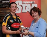 23 July 2011; Elaine Aylward, Kilkenny, is presented with her player of the match trophy by Catherine Neary, Vice President of the Camogie Association. All-Ireland Senior Camogie Championship in association with RTÉ Sport, Kilkenny v Cork, Jenkinstown, Co. Kilkenny. Picture credit: Matt Browne / SPORTSFILE