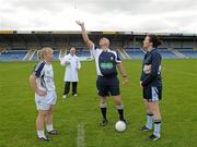 23 July 2011; Kildare captain Donna Berry, left, and Dublin captain Cliodhna O'Connor, look on as referee Eugene O'Hare tosses the coin. TG4 Ladies Football All-Ireland Senior Championship Qualifier Round 1, Dublin v Kildare, Pearse Park, Longford. Photo by Sportsfile