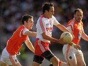 23 July 2011; Mark Donnelly, Tyrone, in action against Brendan Donaghy, Armagh. GAA Football All-Ireland Senior Championship Qualifier Round 3. Tyrone v Armagh, Healy Park, Omagh, Co. Tyrone. Picture credit: Oliver McVeigh / SPORTSFILE