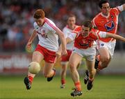 23 July 2011; Peter Harte, Tyrone, in action against Brendan Donaghy, Armagh. GAA Football All-Ireland Senior Championship Qualifier Round 3. Tyrone v Armagh, Healy Park, Omagh, Co. Tyrone. Picture credit: Oliver McVeigh / SPORTSFILE