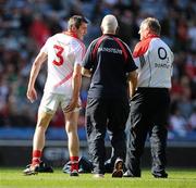 23 July 2011; Cork full-back Graham Canty holds his leg during the warm-up before the game while in conversation with manager Conor Counihan and team doctor, Dr. Con Murphy. Canty subsequently did not start the game. GAA Football All-Ireland Senior Championship Qualifier Round 4, Cork v Down, Croke Park, Dublin. Picture credit: Brendan Moran / SPORTSFILE