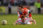23 July 2011; Peter Harte, Tyrone, in action against against Brendan Donaghy, Armagh. GAA Football All-Ireland Senior Championship Qualifier Round 3. Tyrone v Armagh, Healy Park, Omagh, Co. Tyrone. Picture credit: Oliver McVeigh / SPORTSFILE
