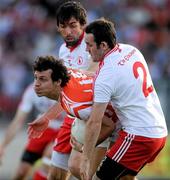23 July 2011; Jamie Clarke, Armagh, in action against Joe McMahon and Martin Swift, right, Tyrone. GAA Football All-Ireland Senior Championship Qualifier Round 3. Tyrone v Armagh, Healy Park, Omagh, Co. Tyrone. Picture credit: Oliver McVeigh / SPORTSFILE