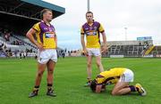 23 July 2011; Wexford players, from left to right, Conor Carty, Paddy Byrne and Brian Malone, shows their disappointment after defeat to Limerick. GAA Football All-Ireland Senior Championship Qualifier Round 4, Wexford v Limerick, O'Moore Park, Portlaoise, Co. Laois. Picture credit: Diarmuid Greene / SPORTSFILE