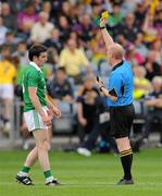23 July 2011; Ger Collins, Limerick, is shown a yellow card by referee Derek Fahy. GAA Football All-Ireland Senior Championship Qualifier Round 4, Wexford v Limerick, O'Moore Park, Portlaoise, Co. Laois. Picture credit: Diarmuid Greene / SPORTSFILE