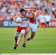 23 July 2011; Sean Cavanagh, Tyrone, in action against Malachy Mackin, Armagh. GAA Football All-Ireland Senior Championship Qualifier Round 3. Tyrone v Armagh, Healy Park, Omagh, Co. Tyrone. Picture credit: Michael Cullen / SPORTSFILE
