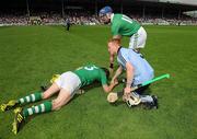 24 July 2011; Maurince O'Brien, Dublin, and Limerick's Stephen Lucey console Seamus Hickey, after the game. GAA Hurling All-Ireland Senior Championship Quarter Final, Dublin v Limerick, Semple Stadium, Thurles, Co. Tipperary. Picture credit: Diarmuid Greene / SPORTSFILE
