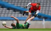 19 February 2017; Darran O'Sullivan of Glenbeigh-Glencar jumps over Thomas Bloomer of Rock St Patrick's after picking up an injury late in the first half during the AIB GAA Football All-Ireland Junior club championship final match between Rock St. Patrick's and Glenbeigh-Glencar at Croke Park in Dublin. Photo by Piaras Ó Mídheach/Sportsfile