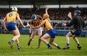 19 February 2017; TJ Reid of Kilkenny kicks towards goal despite pressure from Cian Dillon of Clare. Reid was subsequently awarded a penalty by referee James Owens during the Allianz Hurling League Division 1A Round 2 match between Clare and Kilkenny at Cusack Park in Ennis. Photo by Diarmuid Greene/Sportsfile