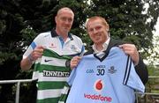 25 July 2011; Dublin senior football manager Pat Gilroy, left, shows which side he'll be supporting, alongside Glasgow Celtic manager Neil Lennon, ahead of the Dublin Super Cup which takes place on July 30th and 31st. St Clare's, DCU, Ballymun, Dublin. Picture credit: Brendan Moran / SPORTSFILE