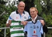 25 July 2011; Dublin senior football manager Pat Gilroy, left, shows which side he'll be supporting, alongside Glasgow Celtic manager Neil Lennon, ahead of the Dublin Super Cup which takes place on July 30th and 31st. St Clare's, DCU, Ballymun, Dublin. Picture credit: Brendan Moran / SPORTSFILE