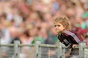 24 July 2011; A young Galway supporter watches on during the game. Supporters at the GAA Hurling All-Ireland Senior Championship Quarter-Finals, Semple Stadium, Thurles, Co. Tipperary. Picture credit: Diarmuid Greene / SPORTSFILE