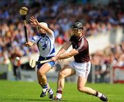 24 July 2011; Shane Kavanagh, Galway, makes a clearance despite the efforts of Stephen Molumphy, Waterford. GAA Hurling All-Ireland Senior Championship Quarter Final, Waterford v Galway, Semple Stadium, Thurles, Co. Tipperary. Picture credit: Dáire Brennan / SPORTSFILE