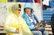 24 July 2011; Waterford supporters take precautions from the rain before the game. Supporters at the GAA Hurling All-Ireland Senior Championship Quarter-Finals, Semple Stadium, Thurles, Co. Tipperary. Picture credit: Diarmuid Greene / SPORTSFILE