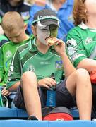 24 July 2011; A Limerick supporter enjoys a snack before the game. Supporters at the GAA Hurling All-Ireland Senior Championship Quarter-Finals, Semple Stadium, Thurles, Co. Tipperary. Picture credit: Diarmuid Greene / SPORTSFILE