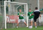 25 July 2011; Republic of Ireland's goalkeepers Aaron McCarey and Sean McDermott, right, with goalkeeping coach Declan McIntyre during squad training ahead of their side's final 2010/11 UEFA European Under-19 Championship group game, on Tuesday, against Romania. 2010/11 UEFA European Under-19 Championship, Concordia Stadium, Chiajna, Bucharest, Romania. Picture credit: Stephen McCarthy / SPORTSFILE