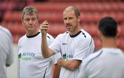 26 July 2011; Airtricity League XI assistant manager Kenny Cunningham, in the company of manager Damien Richardson, speaking to the players during squad training ahead of the upcoming Dublin Super Cup which begins on Saturday. Airtricity League XI Squad Training, Richmond Park, Inchicore, Dublin. Picture credit: Brendan Moran / SPORTSFILE