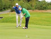 26 July 2011; Special Olympics Ireland athlete Stephen Deignan, Blainroe, Co. Wicklow, who finished 5th in his golfing competition (level 4) at the 2011 Special Olympics World Games in Athens, receives some putting tips from three time Major Champion and Special Olympics Global Ambassador Padraig Harrington who has announced that he will Wear the Laces for Special Olympics in his bid to recapture the Irish Open Championship at the Killarney Golf & Fishing Club from July 28th to July 31st. Wear the Laces is a fundraising and awareness campaign that calls on fans to wear distinctive Special Olympics emblazoned shoelaces to promote respect, acceptance and inclusion for people with intellectual disabilities. For more information visit www.specialolympics.org/wearthelaces or contact Colin Kenny at 01 6755718. Picture credit: Matt Browne / SPORTSFILE