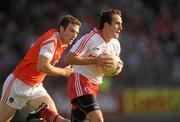 23 July 2011; Mark Donnelly, Tyrone, in action against Brendan Donaghy, Armagh. GAA Football All-Ireland Senior Championship Qualifier Round 3. Tyrone v Armagh, Healy Park, Omagh, Co. Tyrone. Picture credit: Oliver McVeigh / SPORTSFILE