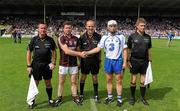 24 July 2011; Waterford captain Stephen Molumphy shakes hands with Galway captain Damian Hayes, under the eye of referee Cathal McAllister and linesmen James McGrath, left, and Barry Kelly. GAA Hurling All-Ireland Senior Championship Quarter Final, Waterford v Galway, Semple Stadium, Thurles, Co. Tipperary. Picture credit: Dáire Brennan / SPORTSFILE