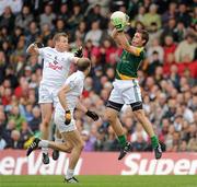 16 July 2011; Stephen Bray, Meath, in action against Morgan O'Flaherty, left, and Hugh McGrillen, Kildare. GAA Football All-Ireland Senior Championship Qualifier, Round 3, Meath v Kildare, Pairc Tailteann, Navan, Co. Meath. Picture credit: Pat Murphy / SPORTSFILE