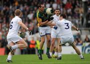 16 July 2011; Cian Ward, Meath, in action against Morgan O'Flaherty, 6, Michael Foley, 3, and Eamonn Callaghan, Kildare. GAA Football All-Ireland Senior Championship Qualifier, Round 3, Meath v Kildare, Pairc Tailteann, Navan, Co. Meath. Picture credit: Pat Murphy / SPORTSFILE