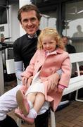 27 July 2011; Jockey Tony McCoy with his daughter Eve, aged 3, during day 3 of the Galway Racing Festival 2011, Ballybrit, Galway. Picture credit: Diarmuid Greene / SPORTSFILE