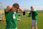 28 July 2011; Republic of Ireland's Jeff Hendrick, left, and Aaron McCarey apply sun cream before squad training ahead of their side's 2010/11 UEFA European Under-19 Championship Semi-Final, on Friday, against Spain. 2010/11 UEFA European Under-19 Championship, Concordia Stadium, Chiajna, Bucharest, Romania. Picture credit: Stephen McCarthy / SPORTSFILE