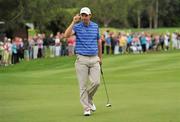 28 July 2011; Padraig Harrington acknowledges the crowd on the 18th green after finishing his first round of the 2011 Discover Ireland Irish Open Golf Championship, Killarney Golf & Fishing Club, Killarney, Co. Kerry. Picture credit: Diarmuid Greene / SPORTSFILE