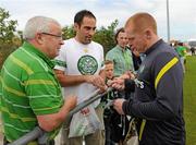 29 July 2011; Glasgow Celtic manager Neil Lennon signs autographs for Albert Flynn, from Dublin, and Joe Pascuzzi, from Brisbane, Australia, during squad training ahead of the Dublin Super Cup. Gannon Park, Malahide, Co. Dublin. Picture credit: Oliver McVeigh / SPORTSFILE