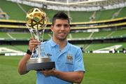 29 July 2011; New Manchester City signing Sergio Aguero holds the Dublin Super Cup after a press conference ahead of the Dublin Super Cup. Aviva Stadium, Lansdowne Road, Dublin. Picture credit: David Maher / SPORTSFILE