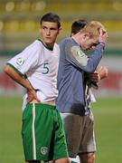 29 July 2011; A dejected Republic of Ireland goalkeeper Aaron McCarey and John Egan, 5, after their side's defeat. 2010/11 UEFA European Under-19 Championship - Semi-Final, Spain v Republic of Ireland, Stadionul Concordia, Chiajna, Bucharest, Romania. Picture credit: Stephen McCarthy / SPORTSFILE