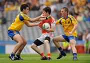 30 July 2011; Brendan McCarron, Armagh, in action against Enda Lannon, left, and Shane Jordan, Roscommon. GAA Football All-Ireland Minor Championship Quarter Final, Roscommon v Armagh, Croke Park, Dublin. Picture credit: Oliver McVeigh / SPORTSFILE