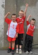30 July 2011; Tyrone supporters Fionnan Molloy, left, aged 6, Cathaoir, aged 9, and Aodán, right, aged 4, from Dungannon, Co. Tyrone, before the game. GAA Football All-Ireland Senior Championship Qualifier, Round 4, Roscommon v Tyrone, Croke Park, Dublin. Picture credit: Dáire Brennan / SPORTSFILE
