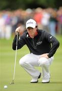 30 July 2011; Rory McIlroy lines up a putt on the 5th green during the third round of the 2011 Discover Ireland Irish Open Golf Championship, Killarney Golf & Fishing Club, Killarney, Co. Kerry. Picture credit: Diarmuid Greene / SPORTSFILE